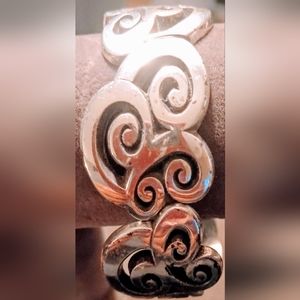 Swirl spy world design pattern cuff link bracelet.